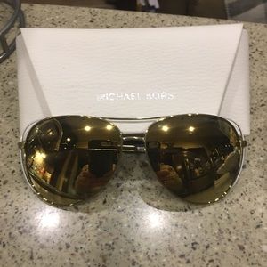 Brand new never worn Micheal Kors sunglasses .